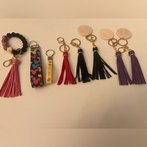 KEY CHAINS. COLORFUL TASSEL FAUX LEATHER KEY CHAINS AND TWO WRISTLET KEY CHAINS